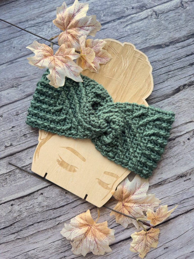 Spiral aran crochet headband with twisted front – textured cable ear warmer for women