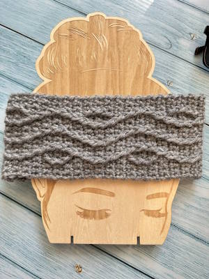 Straight cable weave crochet headband showing the full textured cable stitch pattern small size