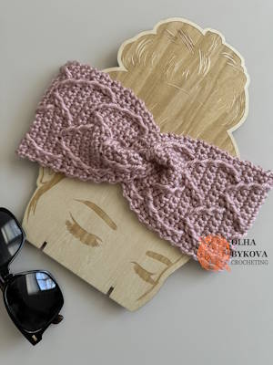 Elegant Hearts crochet headband with twisted front finish highlighting heart texture small size