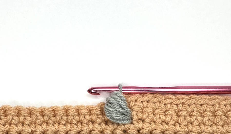 Finished Return 1 Front Post Puff Stitch showing the completed texture and stitch definition in crochet