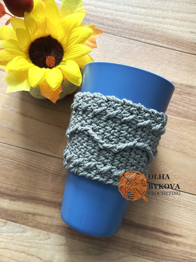 Crochet coffee sleeve on cup, textured cup cozy with cable style stitches, free crochet pattern Wavy Line