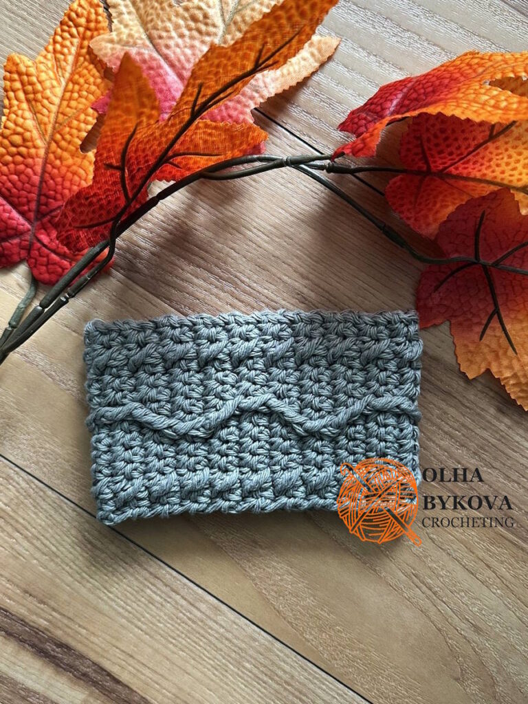 Textured crochet cup cozy in soft cotton yarn, Wavy Line coffee sleeve pattern with cable and aran inspired stitches