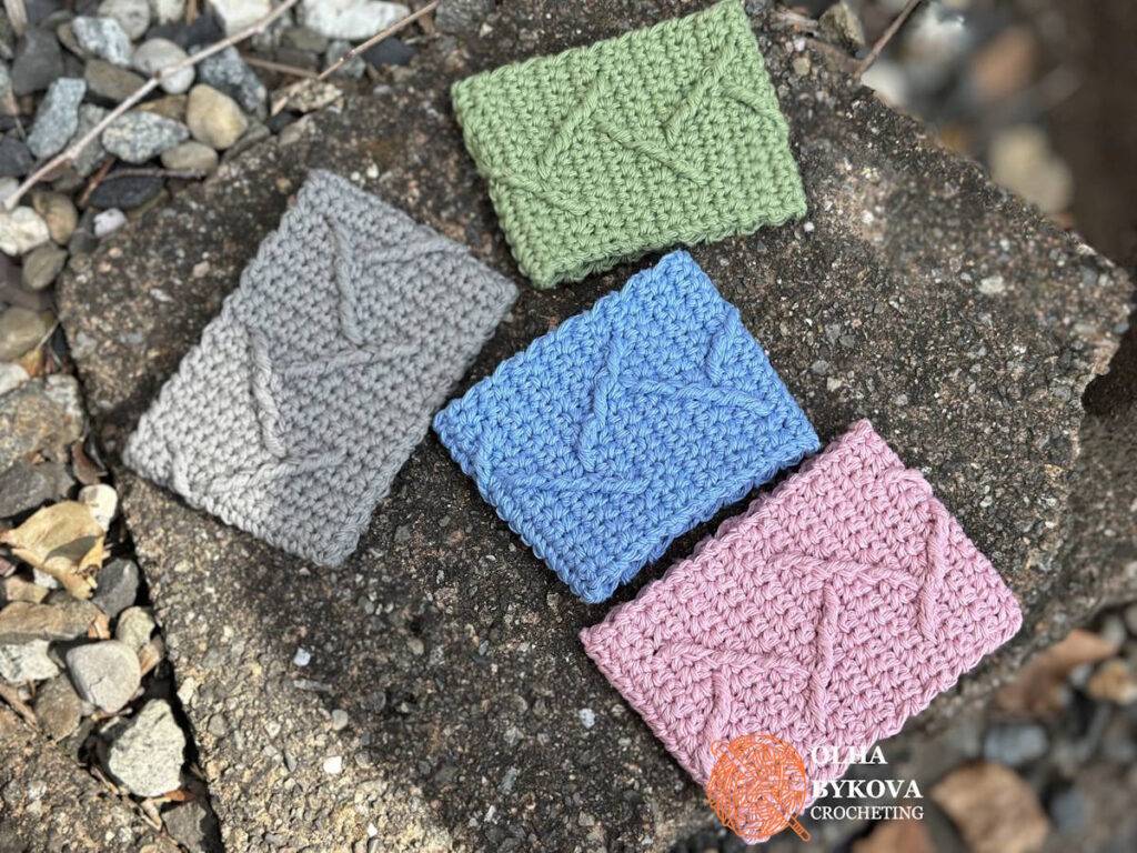 set of crochet cup cozies in different colors using mountain peaks textured pattern