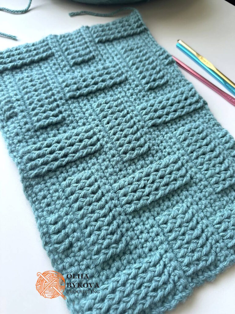 Angled view of basketweave crochet stitch pattern highlighting textured brick design and stitch depth
