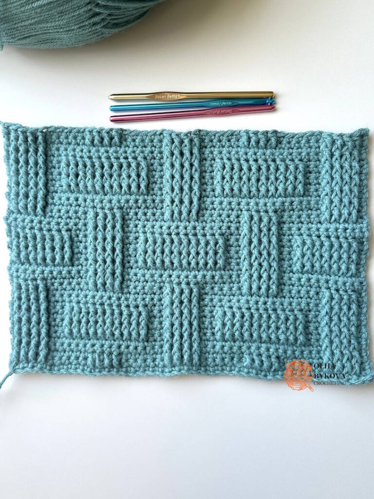 Detailed view of textured crochet stitch pattern with basketweave brick effect and raised stitches