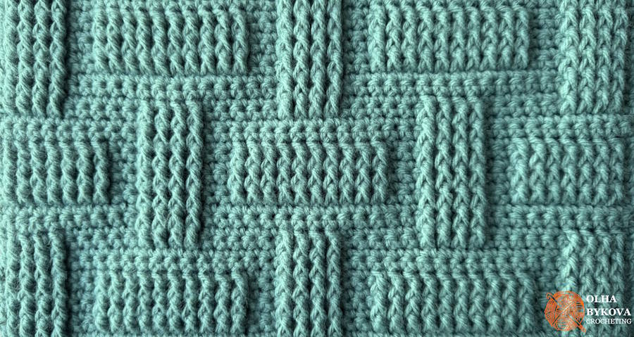 Close-up of textured crochet stitch pattern showing basketweave brick texture with raised front post stitches
