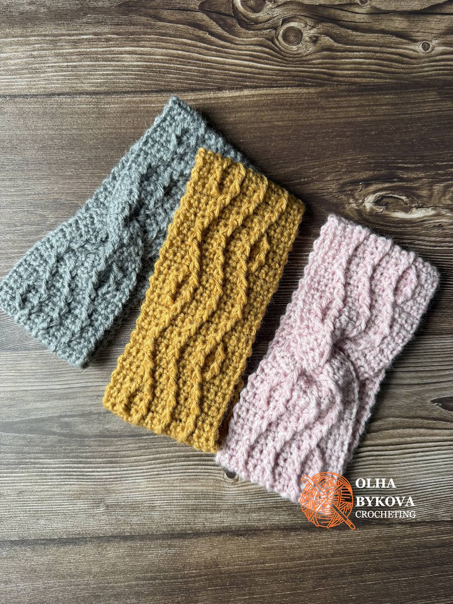 Free cable crochet headband pattern shown in blush pink, golden yellow, and gray