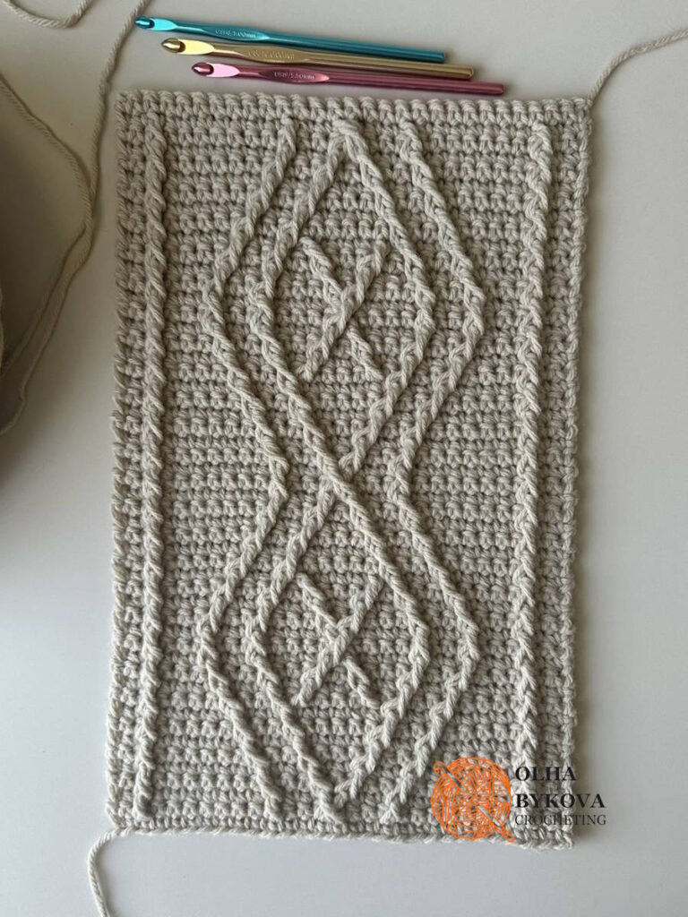 Diamond Frame Crochet Cable Stitch crochet stitch pattern with textured crochet cables forming geometric diamond frames.
