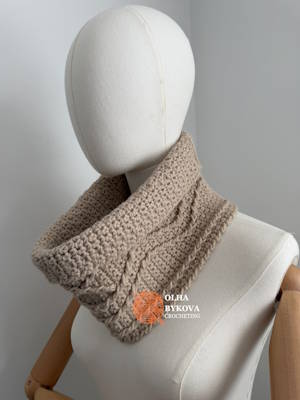Textured crochet cable cowl worn around the neck, showing its height, shape, and soft folded edge preview